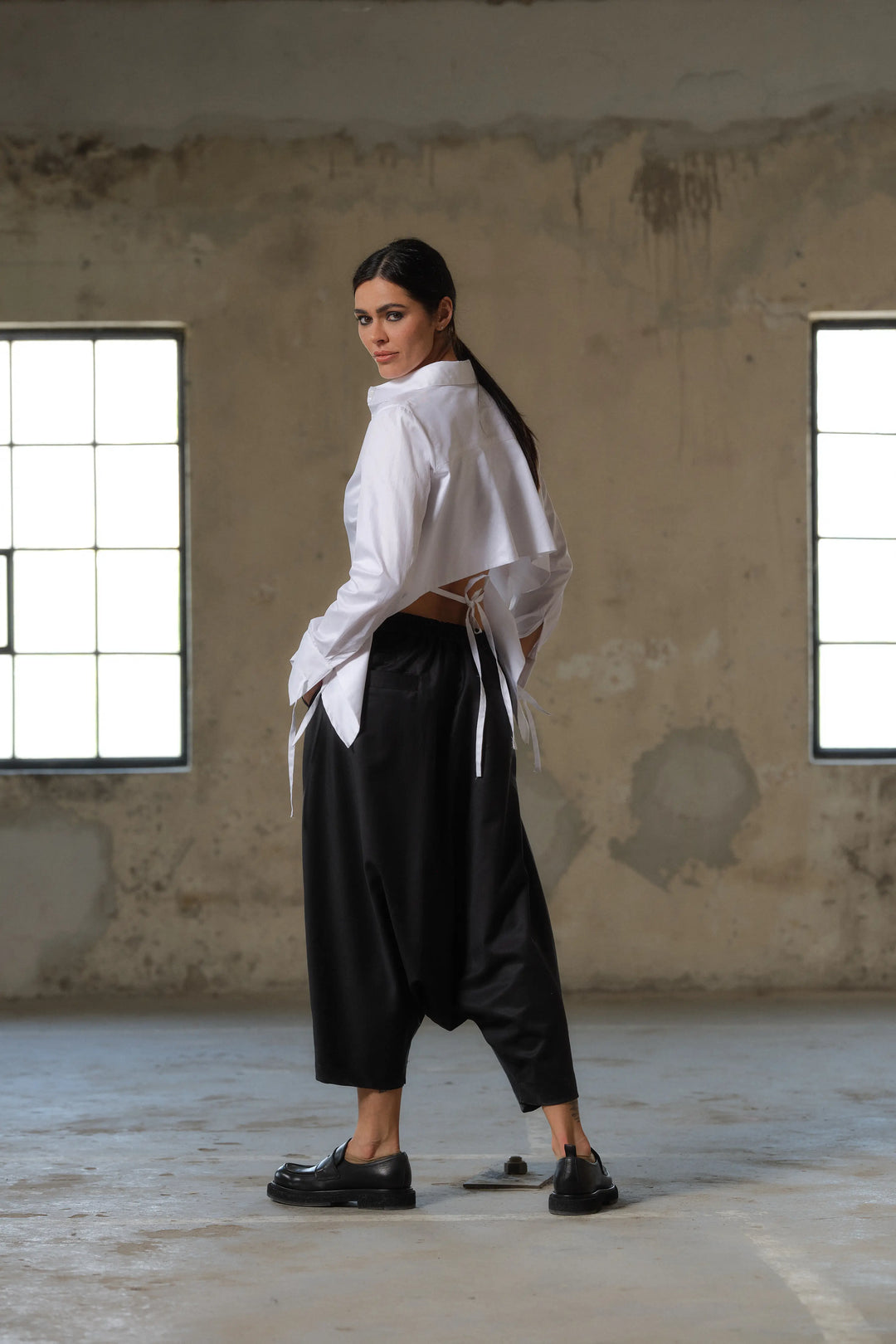 Black wool drop crotch winter pants with asymmetrical details