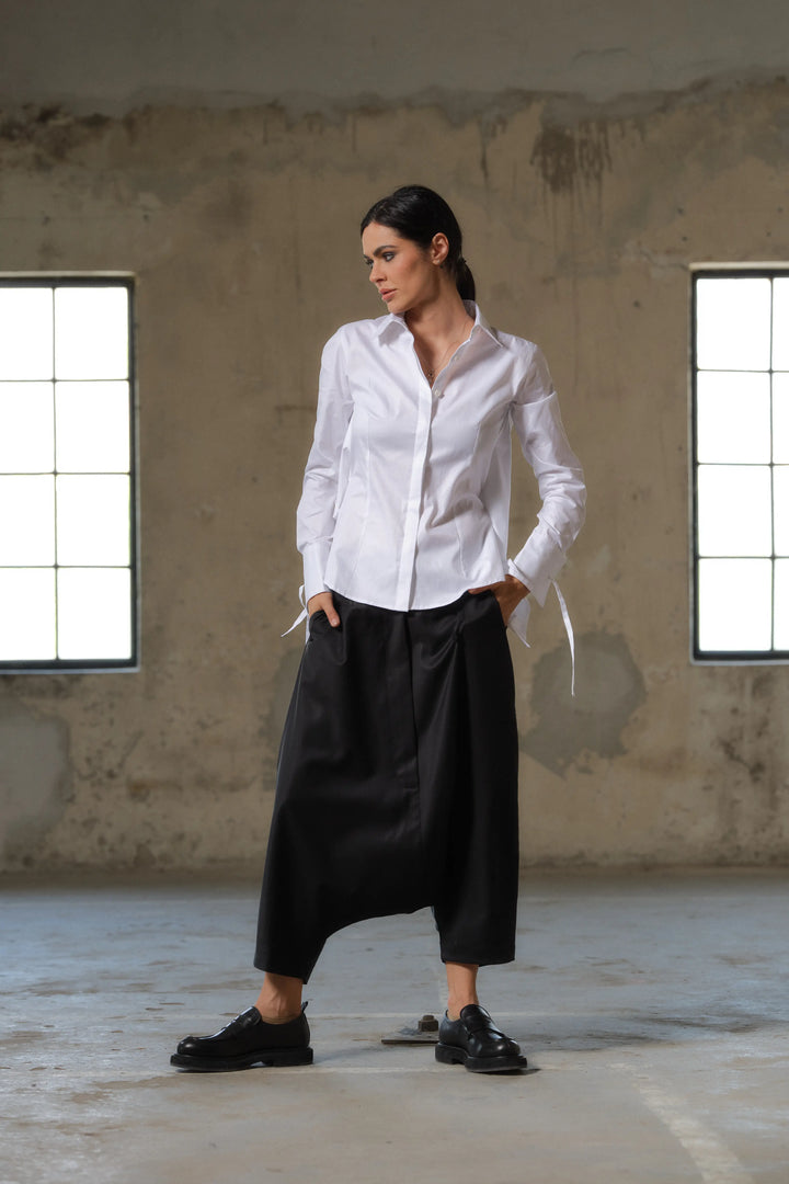 Black wool drop crotch winter pants with asymmetrical details