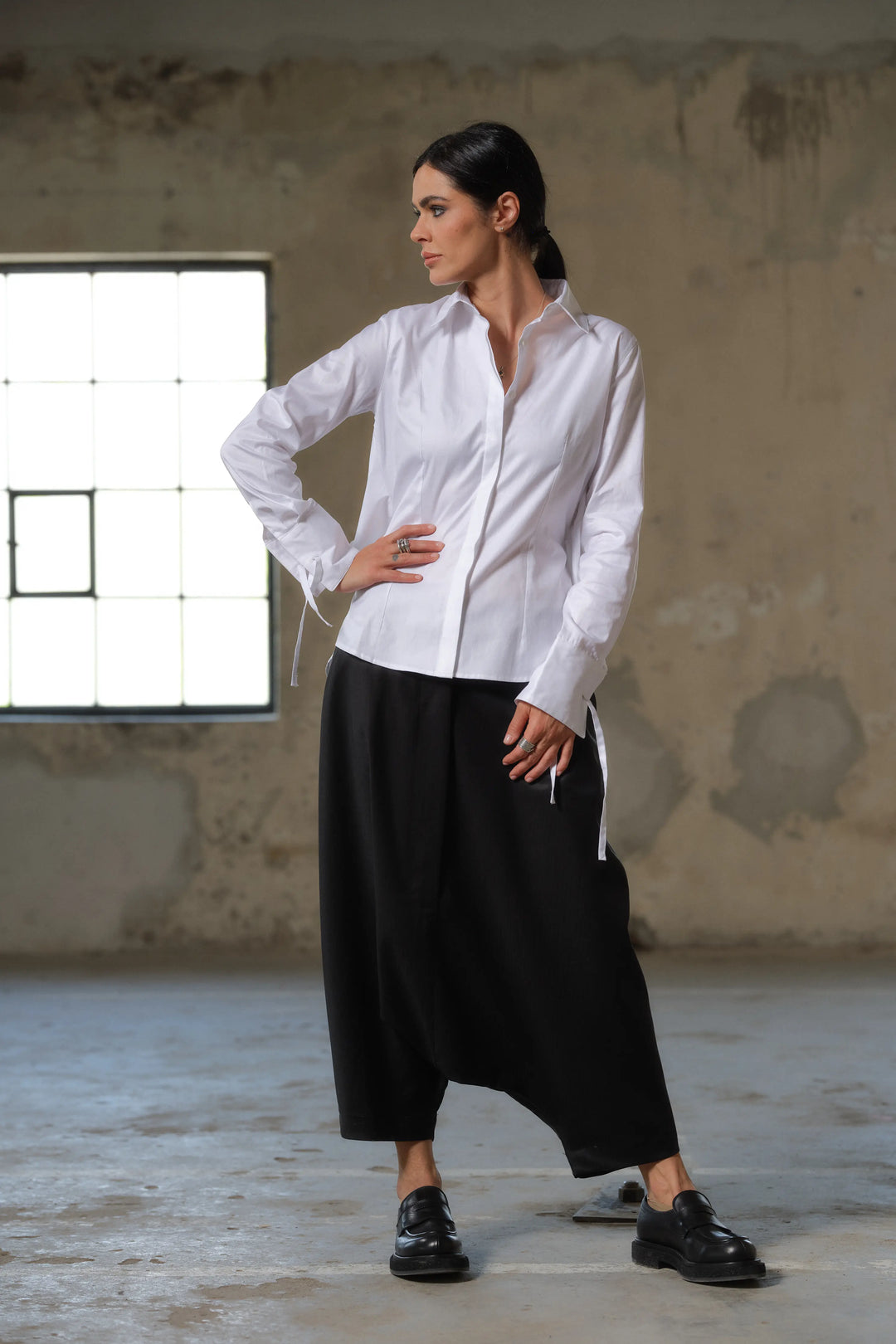 Black wool drop crotch winter pants with asymmetrical details