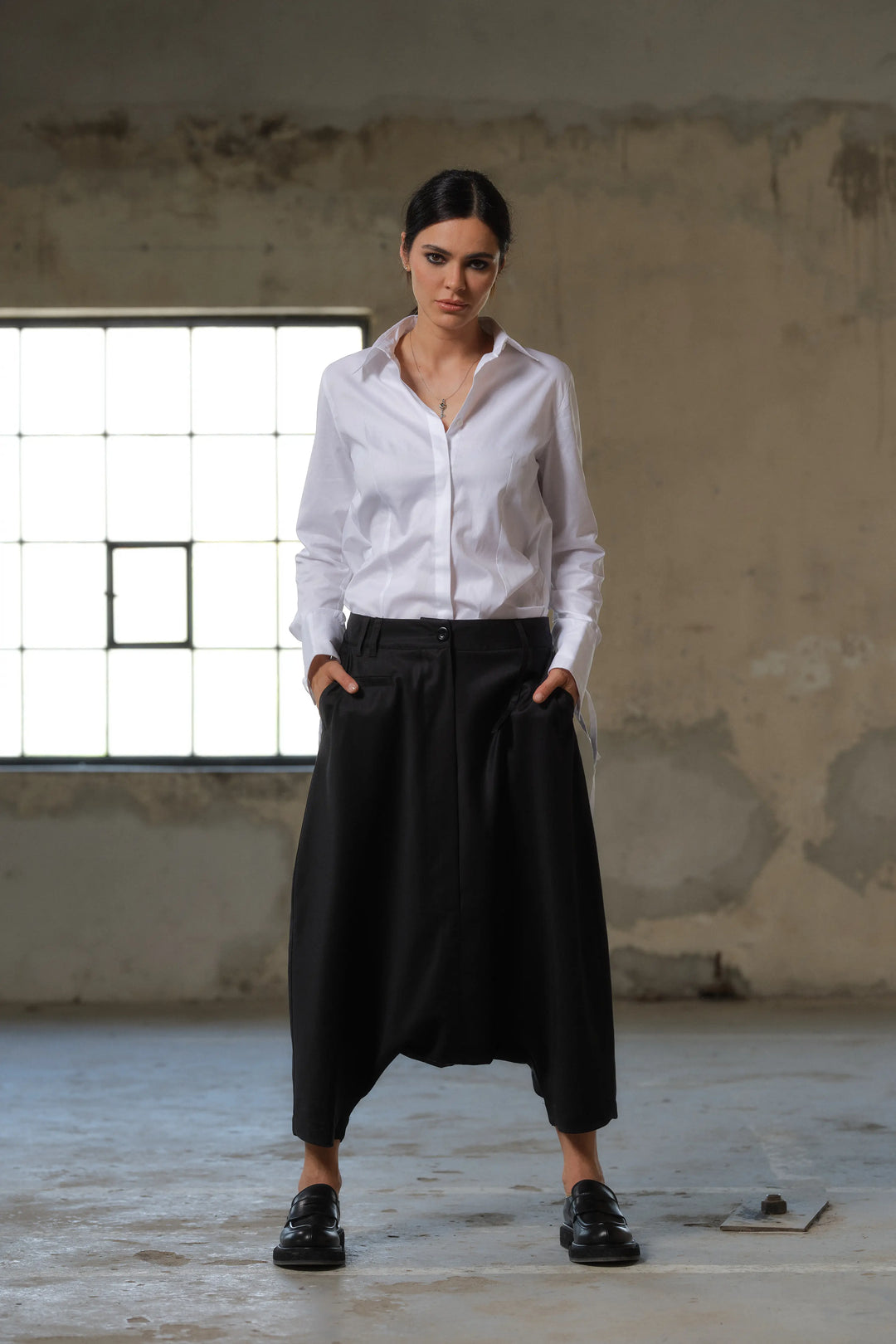 Black wool drop crotch winter pants with asymmetrical details