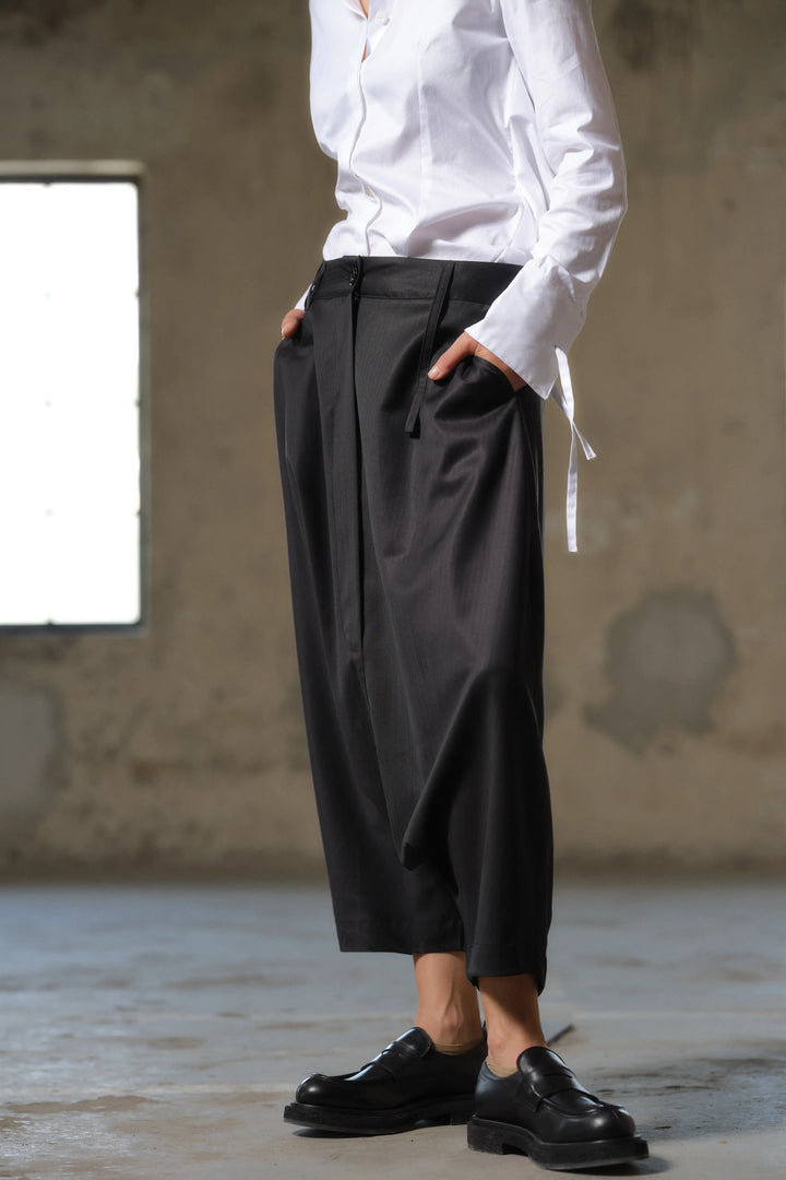 Black wool drop crotch winter pants with asymmetrical details