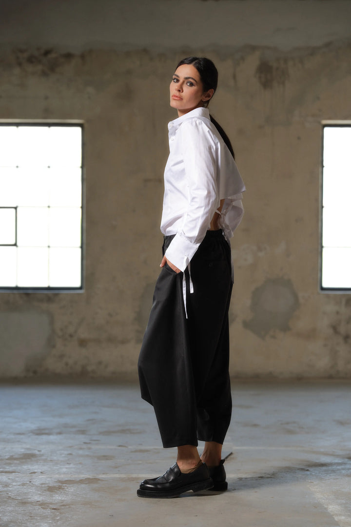 Black wool drop crotch winter pants with asymmetrical details