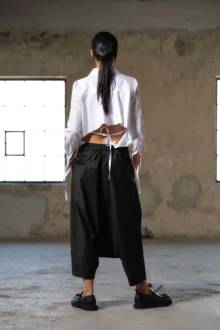 Black wool drop crotch winter pants with asymmetrical details