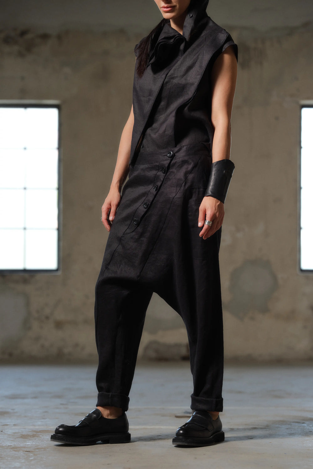 Side view of women's linen pants showcasing relaxed fit and wide belt