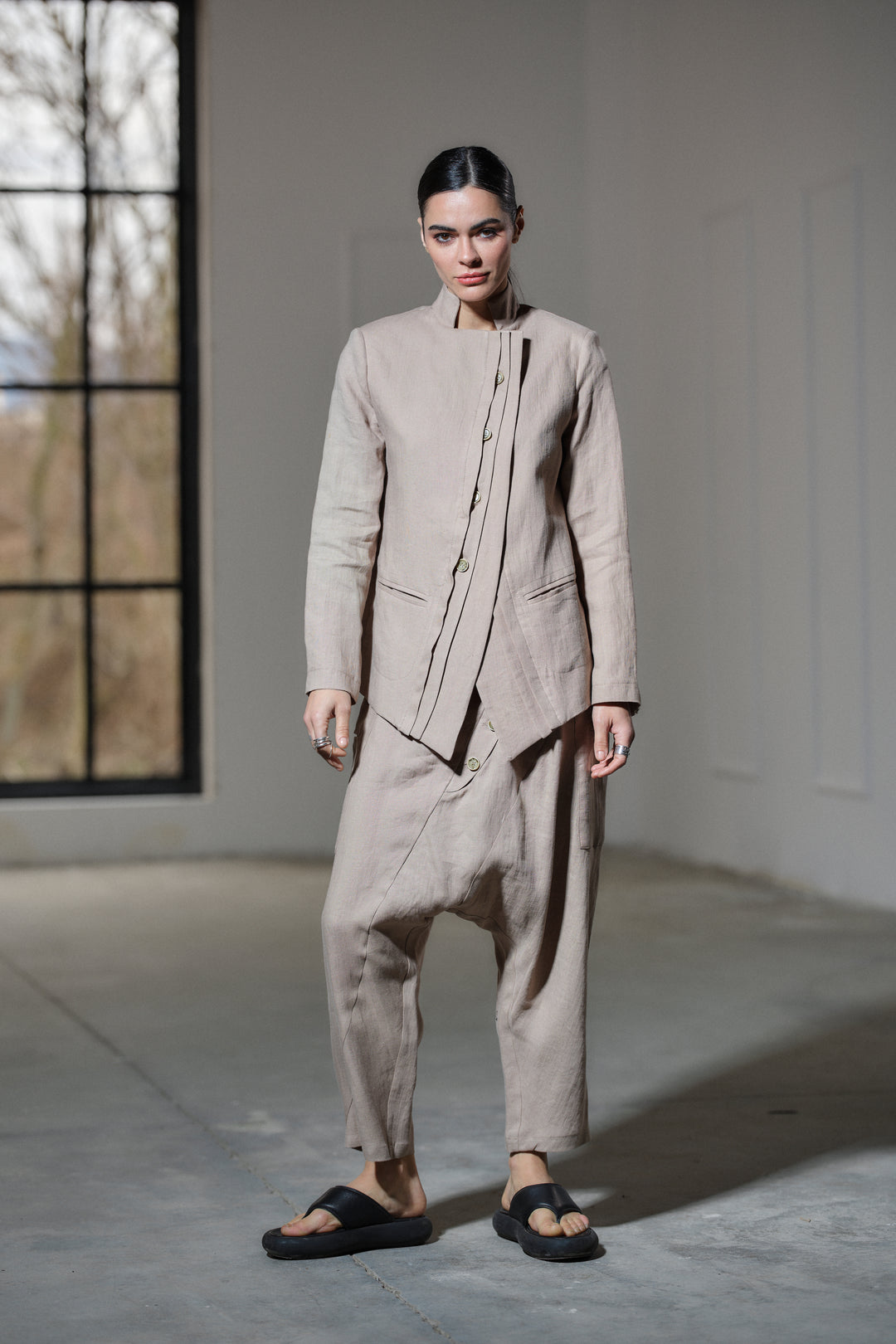 Avant garde linen blazer featuring asymmetrical button closure