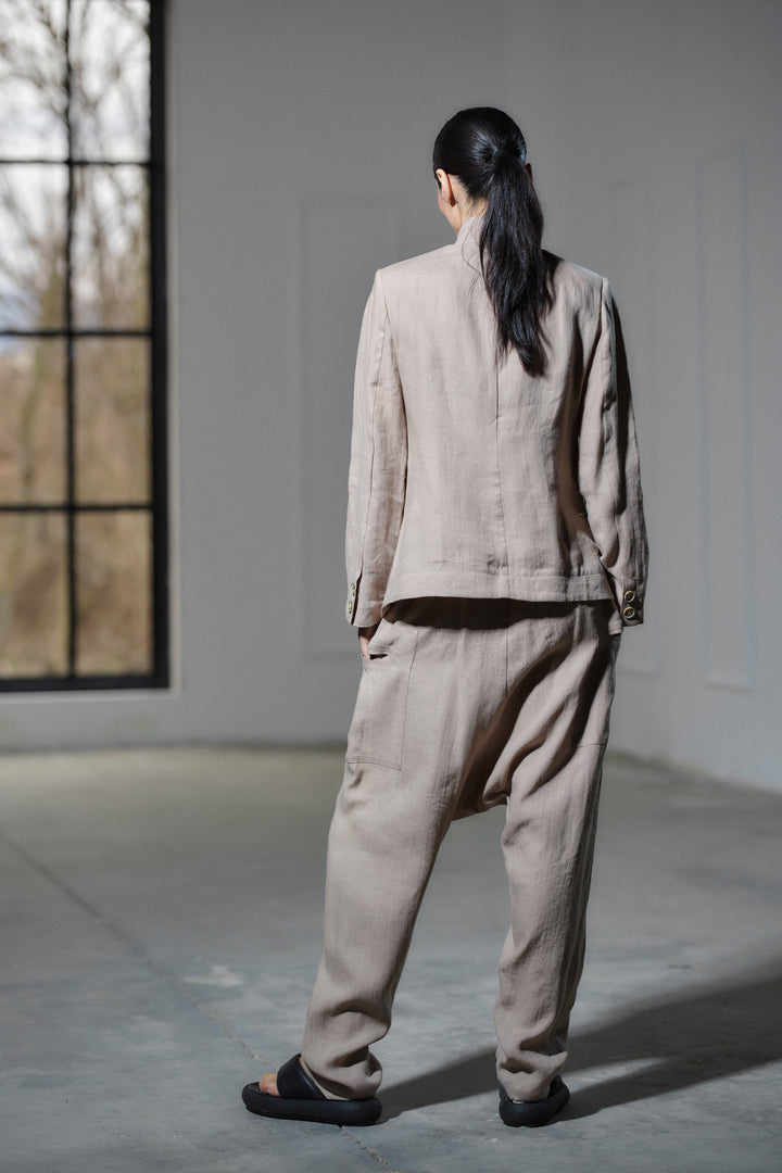 Avant garde linen blazer featuring asymmetrical button closure