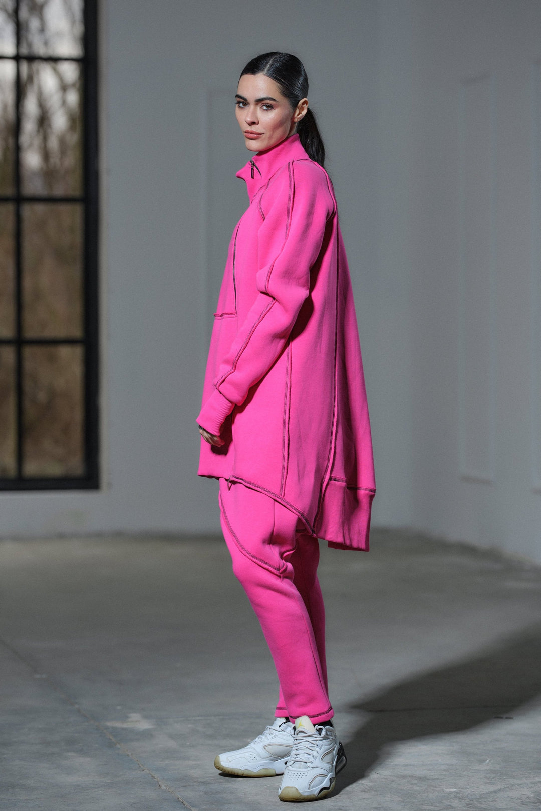 Asymmetrical oversized cotton sweatshirt in fuchsia