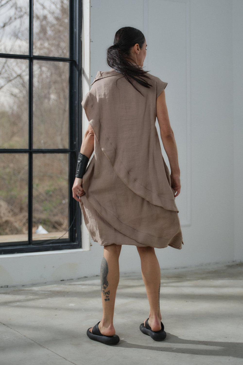 Asymmetrical beige linen dress with decorative ruffles