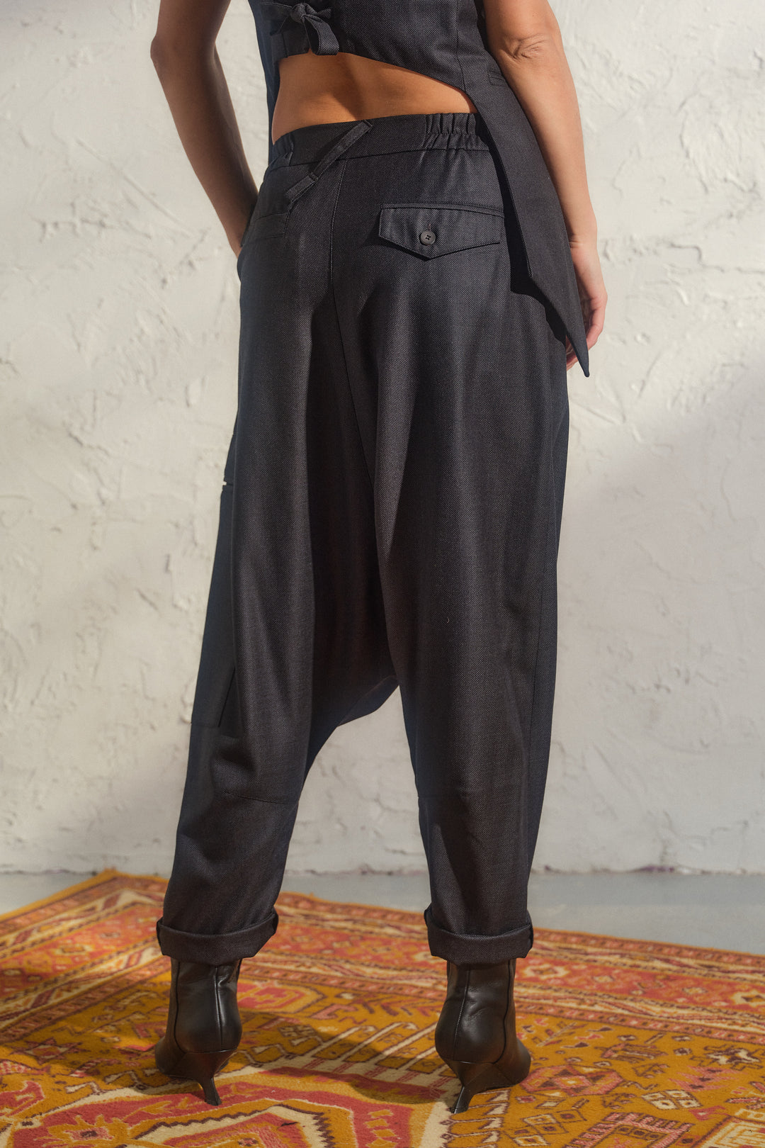 Merino wool baggy pants with asymmetrical details
