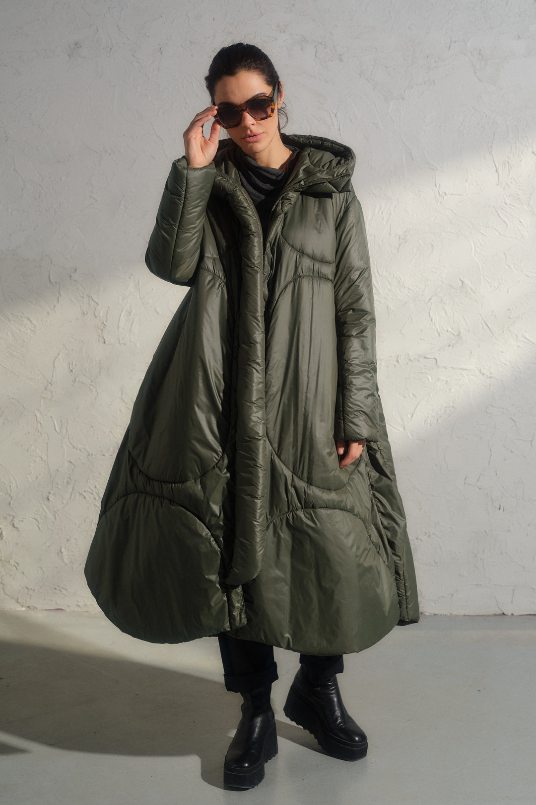 Avant garde transitional puffer jacket with hood