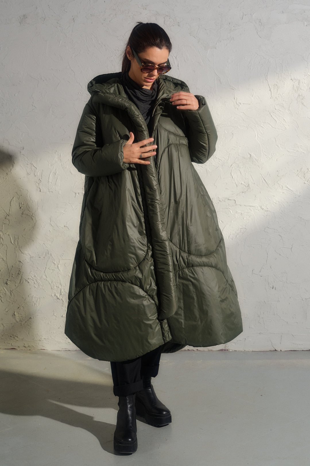 Avant garde transitional puffer jacket with hood