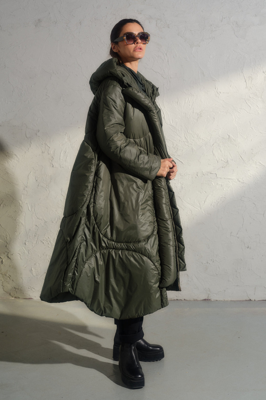 Avant garde transitional puffer jacket with hood