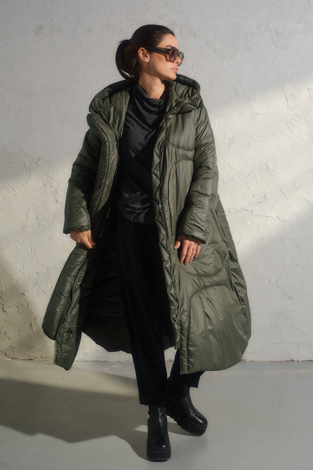 Avant garde transitional puffer jacket with hood