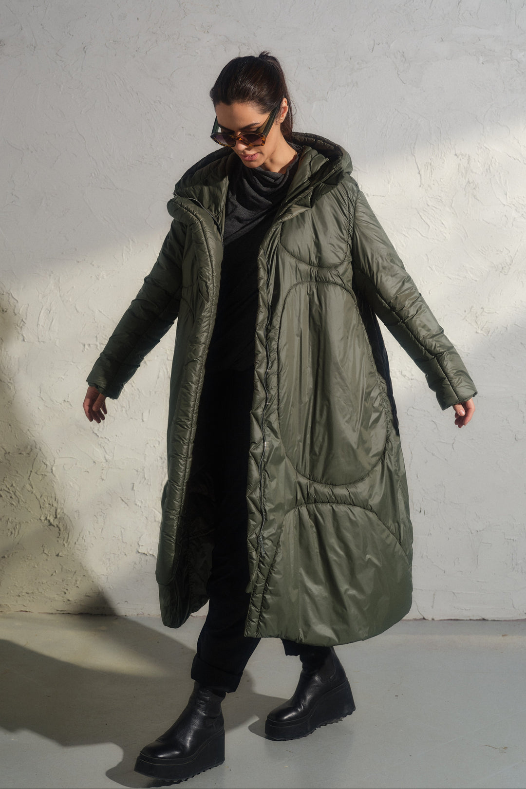 Avant garde transitional puffer jacket with hood