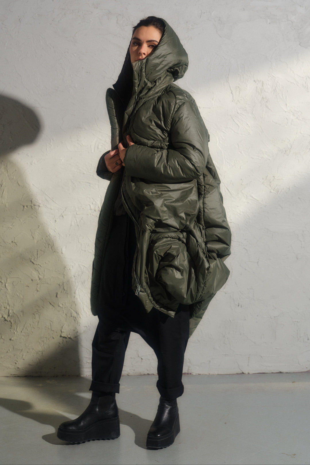 Avant garde transitional puffer jacket with hood