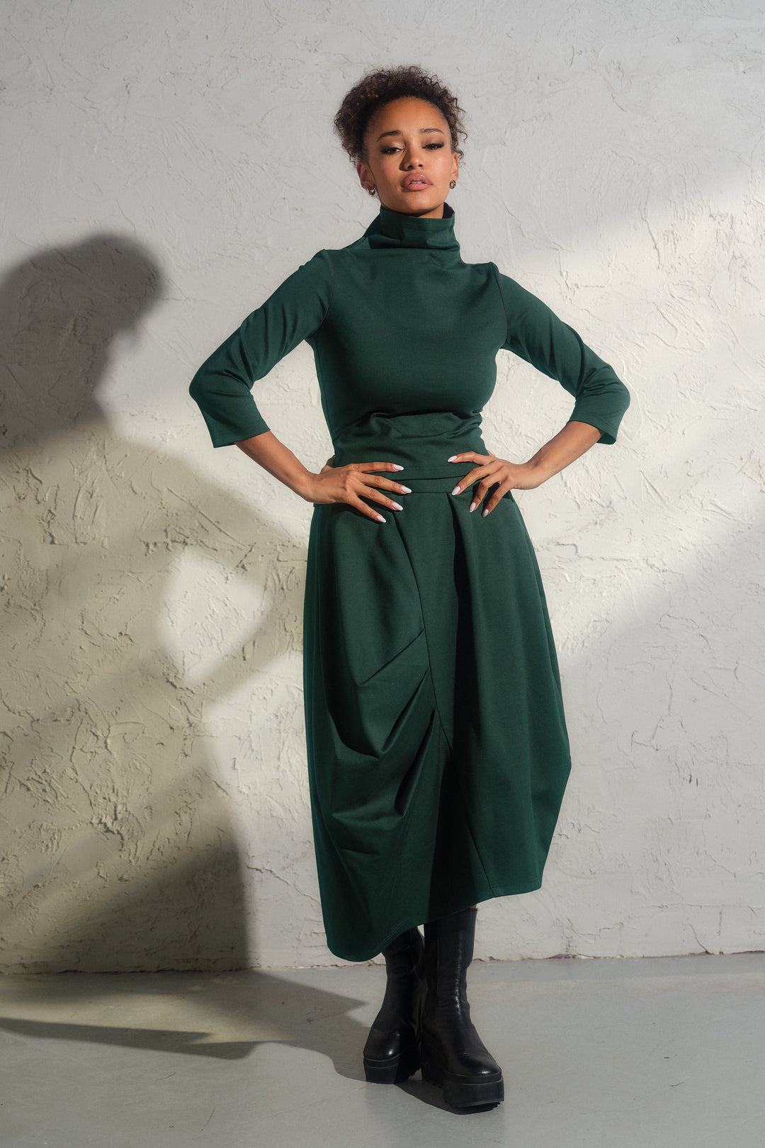 Asymmetrical viscose midi skirt in emerald green