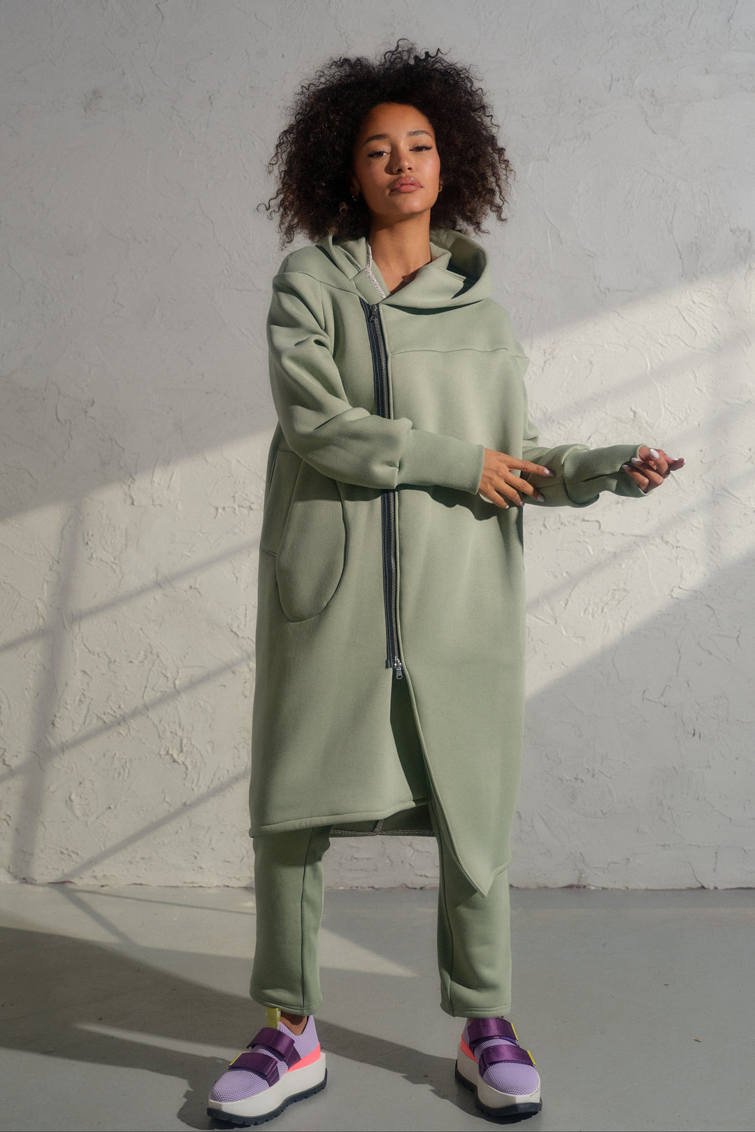 Asymmetrical organic cotton hoodie in Green Tea color