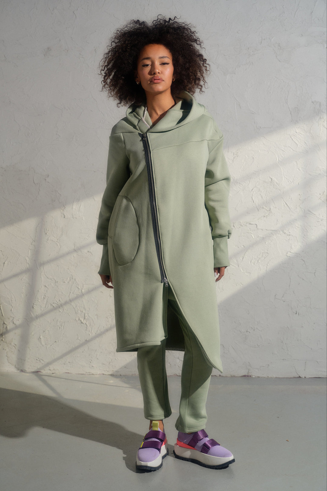 Asymmetrical organic cotton hoodie in Green Tea color