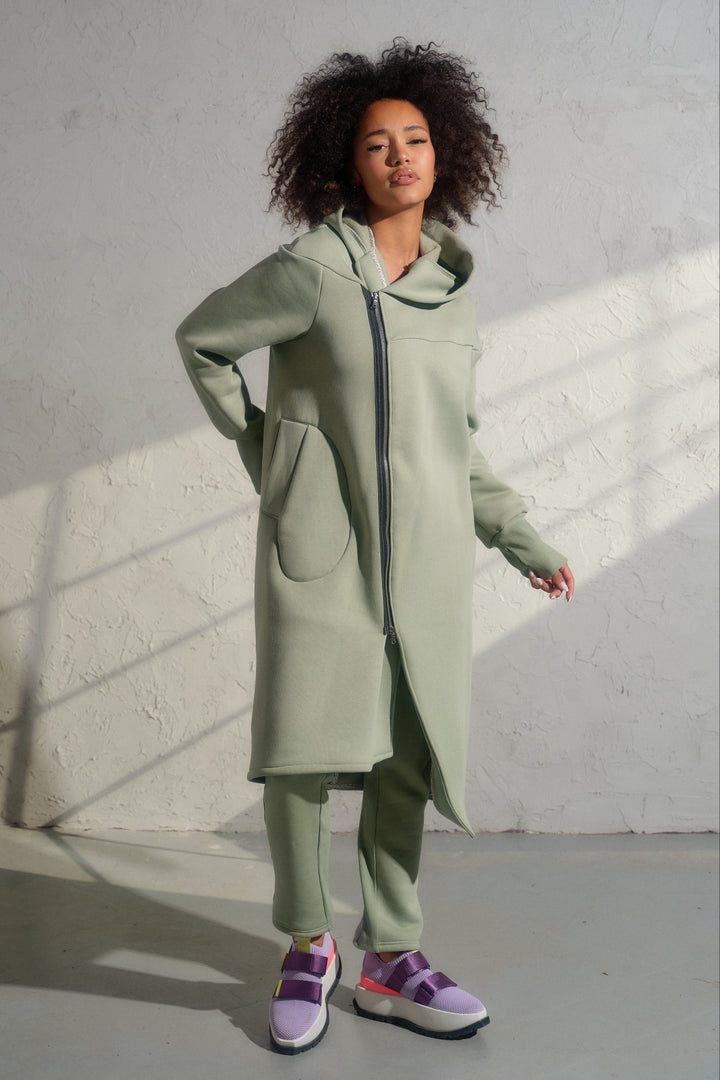 Asymmetrical organic cotton hoodie in Green Tea color