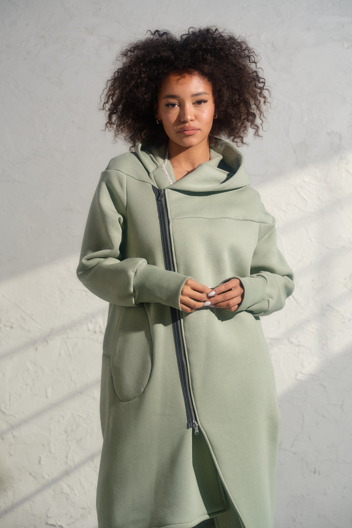 Asymmetrical organic cotton hoodie in Green Tea color