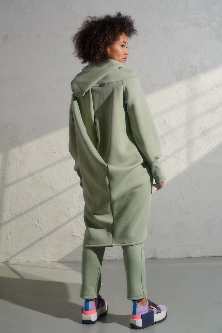 Asymmetrical organic cotton hoodie in Green Tea color