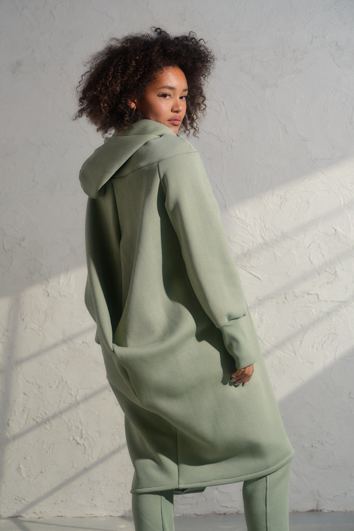 Asymmetrical organic cotton hoodie in Green Tea color